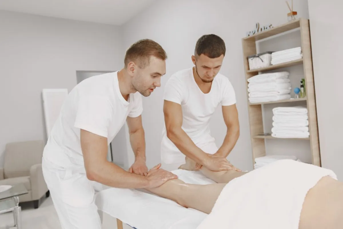 Provider treating lateral hip pain with shockwave therapy